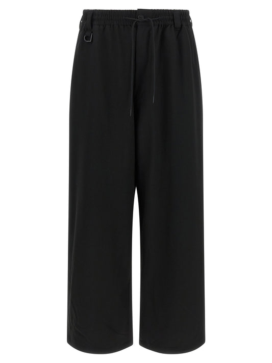 Trousers by Y-3 for men in polyester viscose & wool black presents a perennial silhouette, meticulously tailored with a relaxed-fit cut, long finish, and an elegant .