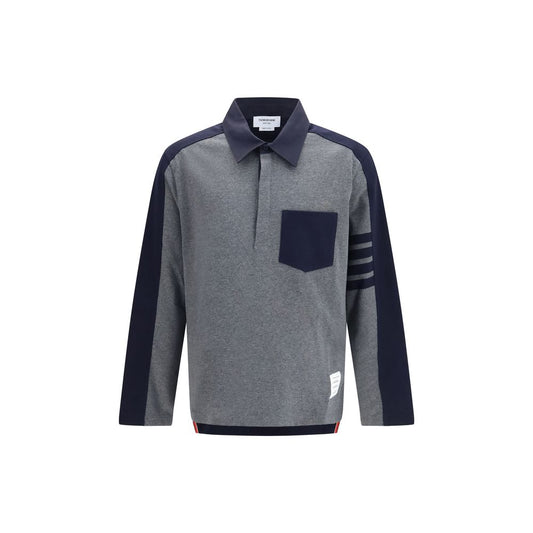 This Polo Shirt by Thom Browne for men in cotton twill gray, signature & striped presents a flawless silhouette, showcasing flawless detailing and a refined for a truly flawless aesthetic.