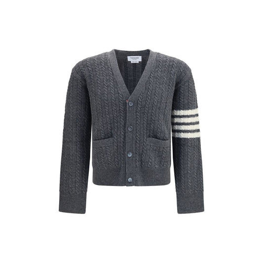 Cardigan by Thom Browne for men in wool gray & signature features a nuanced silhouette with a refined v-neck neckline and nuanced detailing for a sophisticated look.