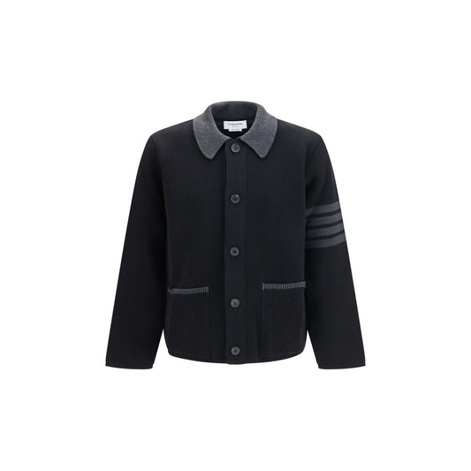 This Jacket by Thom Browne for men in wool cotton & polyamide black, signature & striped showcases a magnificent silhouette, meticulously crafted with a distinctive and functional pockets for a magnificent finish.