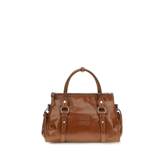 Handbag by Miu Miu for women in bos taurus calf leather & steel brown features a refined silhouette, showcasing a secure zipper, organized , and versatile shoulder-strap, adjustable-strap & handle for a refined finish.