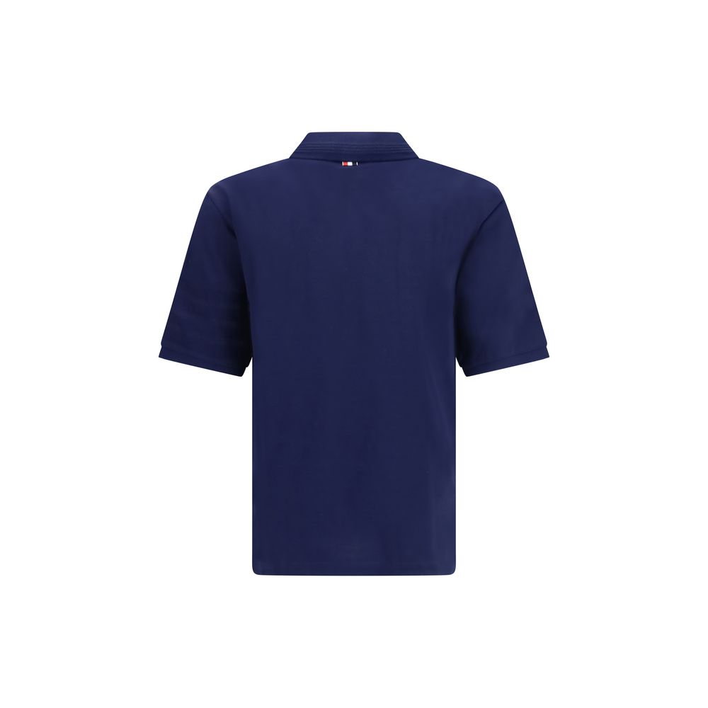 This Polo Shirt by Thom Browne for men in cotton blue & signature presents a flawless silhouette, showcasing flawless detailing and a refined for a truly flawless aesthetic.