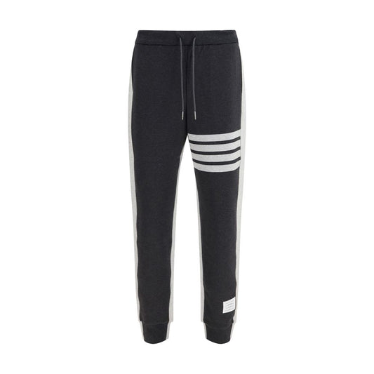 Pants by Thom Browne for men in cotton gray, signature & striped features a utilitarian relaxed-fit & regular-fit with a utilitarian long and to create a sophisticated, premium look.