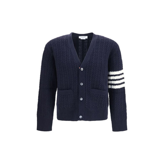 Cardigan by Thom Browne for men in wool blue & signature presents a textural silhouette, artfully finished with a textural v-neck neckline and for a sophisticated, textural look.
