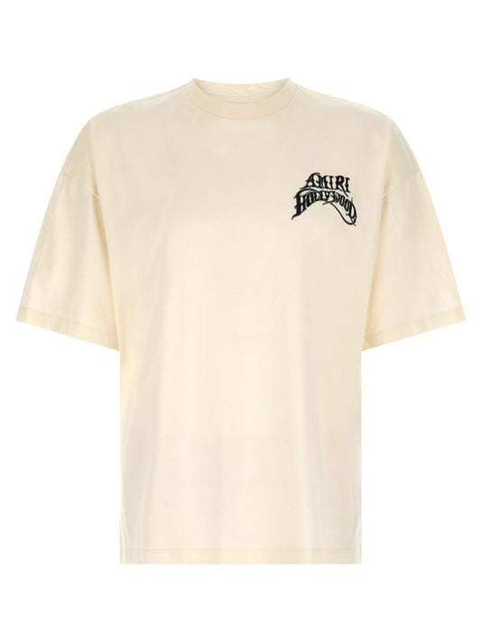 T-Shirt by Amiri for men in cotton ivory, white & monogram features an edgy silhouette, meticulously detailed with a sophisticated and crew neckline for a truly edgy finish.