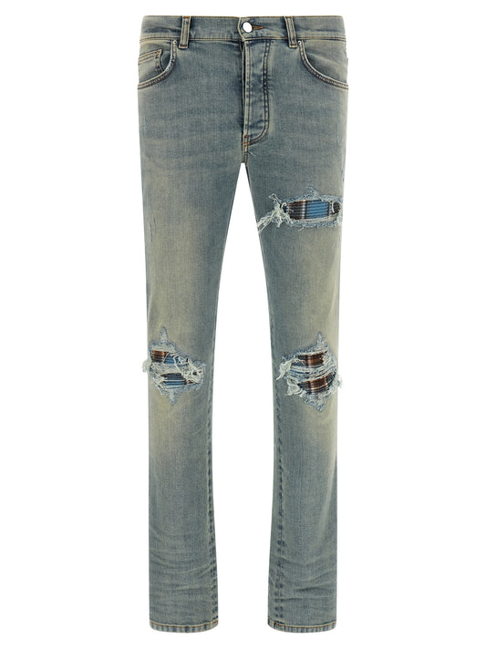 Jeans by Amiri for men in cotton denim flannel & leather brown, indigo, light-blue & silver presents a tailored silhouette, showcasing a tailored skinny and long cut with a refined for a truly tailored aesthetic.