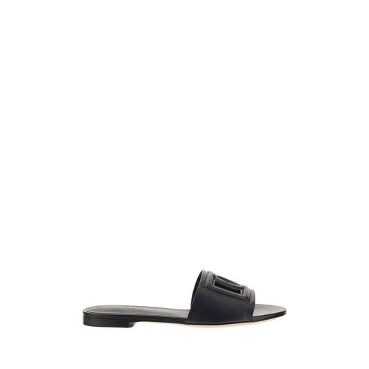 Flat Sandals by Dolce & Gabbana for women in bos taurus calf leather black features an effortlessly chic silhouette from the Women's Bos Taurus Calf Leather Flat Sandals collection, showcasing a effortlessly chic flat and elegant .