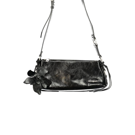 Handbag by Desigual for women in polyurethane black features an refined silhouette, showcasing a secure zipper & magnetic, ample external-pockets & cardholder, and versatile shoulder-strap & adjustable-strap for a sophisticated refined aesthetic.