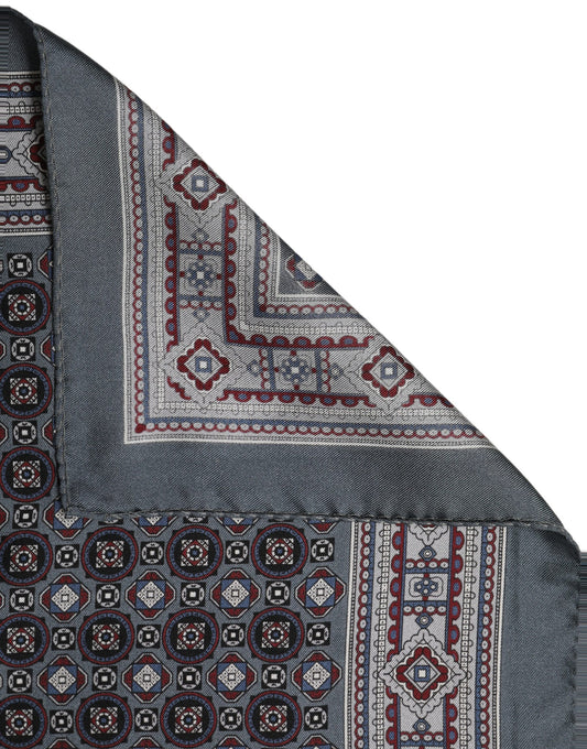 Scarf by Dolce & Gabbana for men in silk gray & patterned presents a effortlessly chic silhouette, artfully capturing the essence of the effortlessly chic Silk Foulard Square Scarf design for a sophisticated look.