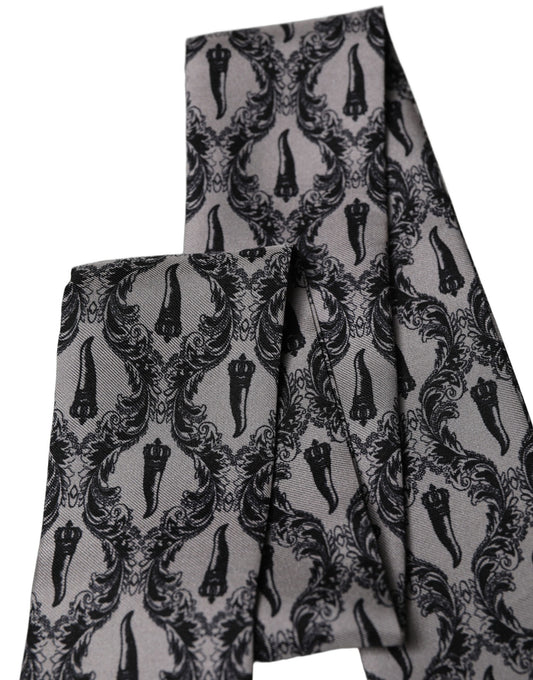 Scarf by Dolce & Gabbana for men in silk black, gray, patterned & print presents a effortlessly chic silhouette, artfully capturing the essence of the effortlessly chic Silk Foulard Fringes Scarf design for a sophisticated look.