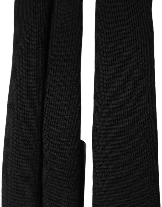 Scarf by Dolce & Gabbana for men in lace & virgin wool black features a snug silhouette, perfectly showcasing the elegant drape and premium finish of the Lace & Virgin Wool Foulard Stole Scarf.
