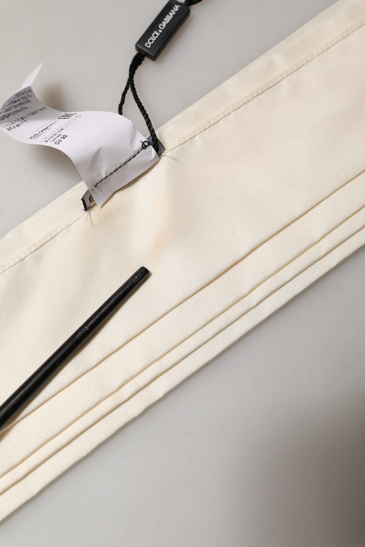 Scarf by Dolce & Gabbana for men in silk satin cream features a timeless silhouette, artfully capturing the essence of the timeless Silk Satin Rectangular Fringes Scarf design for a sophisticated look.