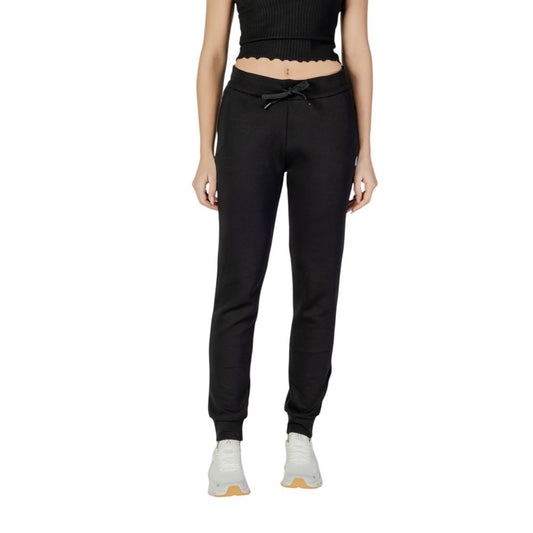 Joggers by Armani Exchange for women in stretch polyester cotton black features a polished silhouette with a polished tapered-leg, reaching a polished long and finished with a polished .