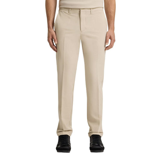 Trousers by Hugo Boss for men in stretch polyester beige presents a perennial silhouette, meticulously tailored with a skinny & slim cut, long finish, and an elegant .