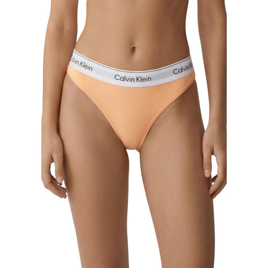 Thongs by Calvin Klein Underwear for women in stretch cotton & modal orange features a contemporary silhouette, showcasing the distinct Women's Low Rise Stretch Cotton & Modal Thongs design with a contemporary cut.