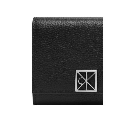 Wallet by Calvin Klein for women in pebbled leather black & signature presents a refined silhouette, artfully capturing the essence of the Pebbled Leather Wallet design with sophisticated compact-design trifold coin-purse for a refined look.