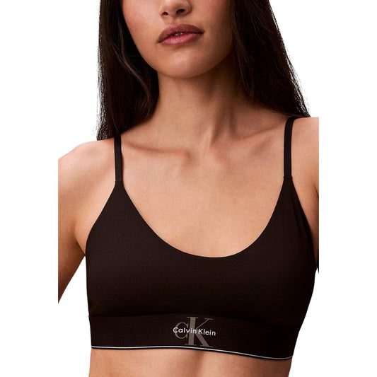 Bra by Calvin Klein Underwear for women in stretch polyester animal, black, natural & print features a sultry design from the Women's Stretch Polyester Bra collection, offering a sultry fit and sophisticated support for an elegant silhouette.