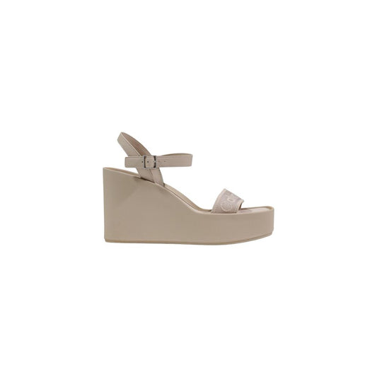 Platform Wedge Ankle Strap Sandals by Calvin Klein for women in polyethylene polyester & polyurethane and beige & signature presents a captivating silhouette, showcasing the signature style of the Women's Polyethylene Polyester & Polyurethane Platform Wedge Ankle Strap Sandals with a captivating platform wedge and captivating .