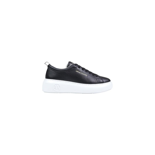 Sneakers by Armani Exchange for women in leather black presents a sumptuous silhouette, artfully capturing the essence of the Women's Low Top Slip On Leather Sneakers with its sumptuous low-top slip-on style design.