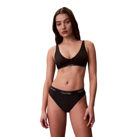Bikini by Calvin Klein Jeans for women in stretch polyester and black presents a sultry silhouette, artfully capturing the sophisticated aesthetic of Women's Stretch Polyester Bikini with a sultry finish.