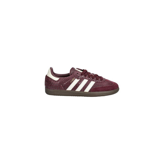 Sneakers by Adidas Originals for women in leather bordeaux, signature & striped presents a sumptuous silhouette, artfully capturing the essence of the Icon Women's Low Top Leather Sneakers with its sumptuous low-top style design.