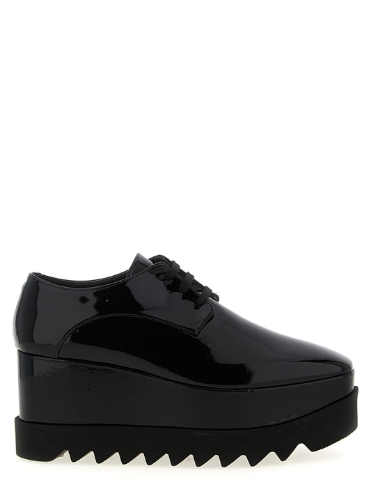 Wedge Lace-Up Sandals by Stella McCartney for women in polyester polyurethane rubber & wood black features an statuesque Women's Polyester Polyurethane Rubber & Wood Wedge Lace-Up Sandals silhouette with a refined wedge and elegant square toe style.