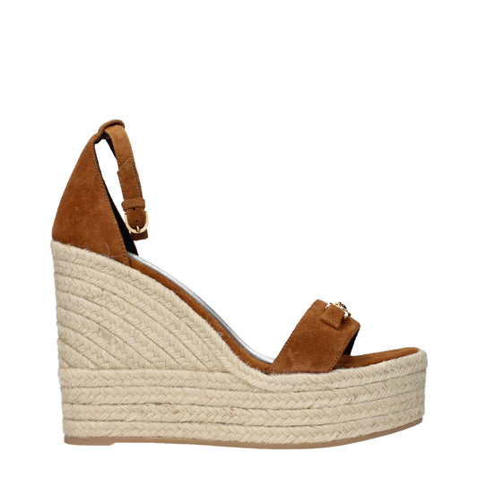 Wedge Sandals by Versace for women in suede leather brown features an effortlessly chic silhouette from the Women's Suede Leather Wedge Sandals collection, showcasing a effortlessly chic wedge and elegant .