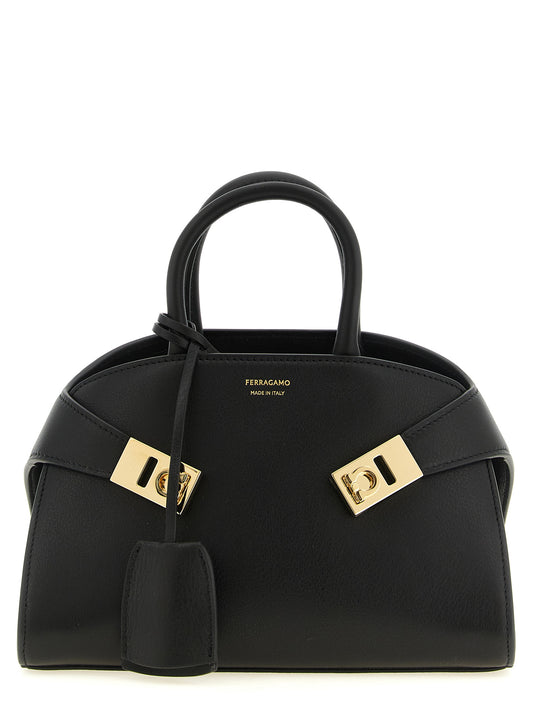 Mini Handbag by Ferragamo for women in bos taurus calfskin leather black features a refined silhouette, showcasing a secure hook, organized , and versatile handle for a refined finish.