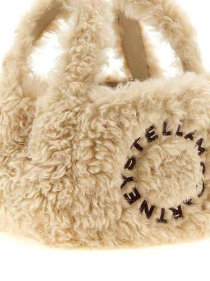 Shoulder Bag by Stella McCartney for women in polyester suede leather beige & gold features a distinguished silhouette, showcasing a secure and distinguished with versatile shoulder-strap, handle & adjustable-strap for a distinguished finish.