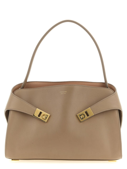 Shoulder Bag by Ferragamo for women in calfskin leather gold, multicolor, pink & signature features a enviable silhouette, showcasing a secure zipper, ample , and enviable shoulder-strap, handle & detachable-strap for a enviable finish.