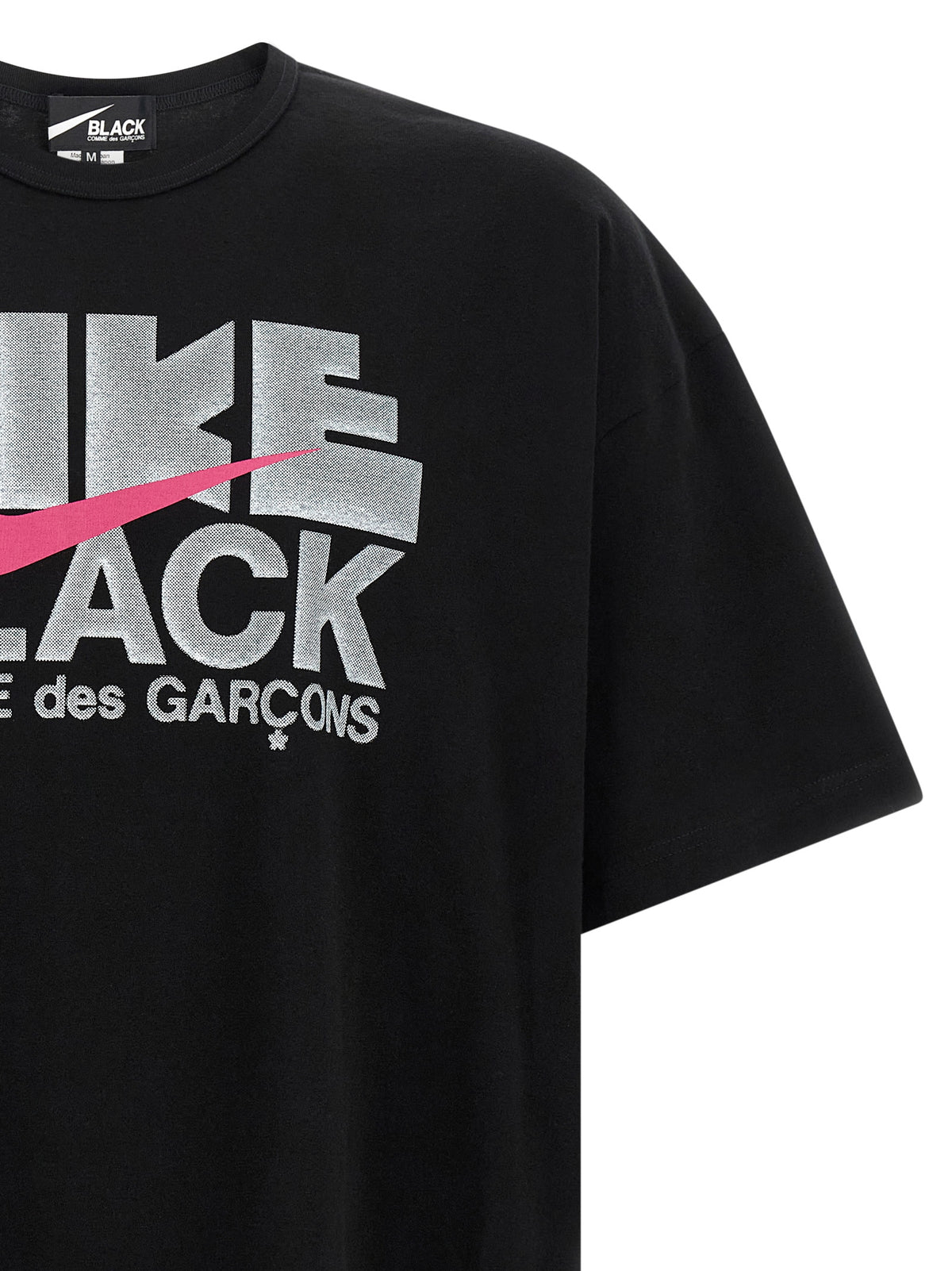 T-Shirt by Comme Des Garçons for men in cotton black & print showcases a unassuming silhouette, artfully detailed with a refined and unassuming for a sophisticated, contemporary look.
