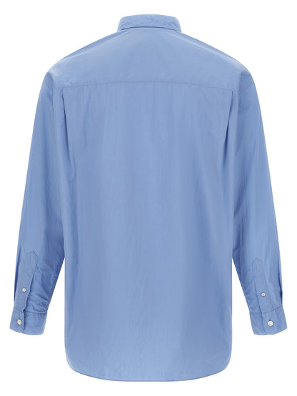 Shirt by Comme Des Garçons for men in cotton canvas light-blue & patchwork features an architectural silhouette with a refined and elegant for a architectural look.
