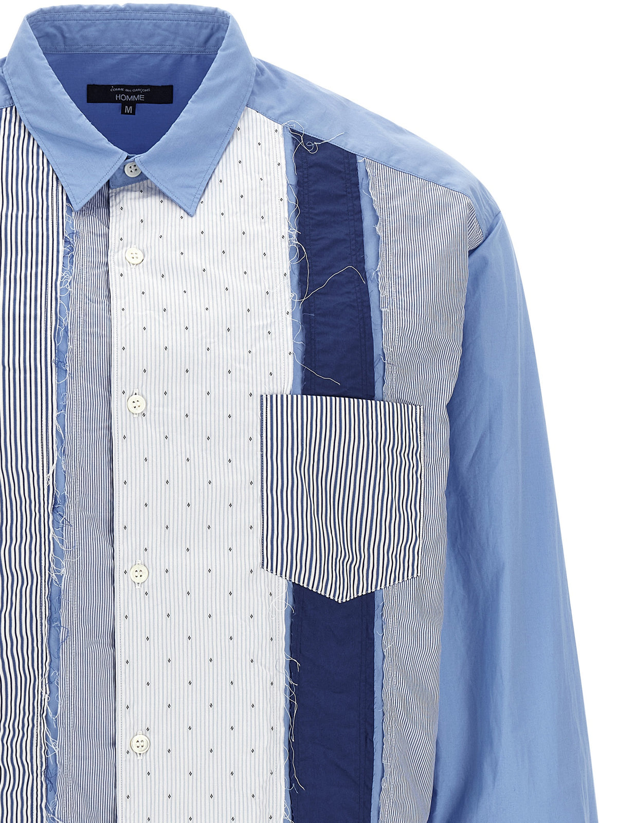 Shirt by Comme Des Garçons for men in cotton canvas light-blue & patchwork showcases a sharp silhouette, elegantly detailed with a sharp and sharp .