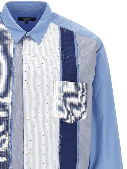 Shirt by Comme Des Garçons for men in cotton canvas light-blue & patchwork showcases a sharp silhouette, elegantly detailed with a sharp and sharp .