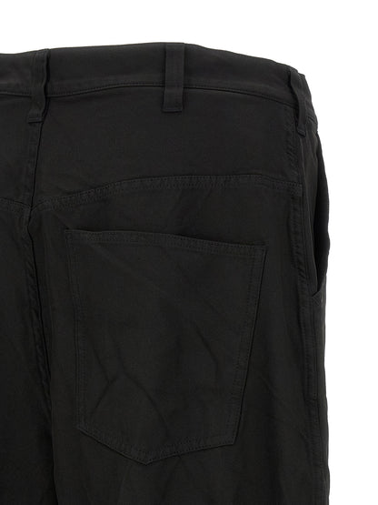 Trousers by Comme Des Garçons for men in polyester black features a tailored silhouette with a tailored relaxed-fit & wide, defined by its long and a sophisticated .
