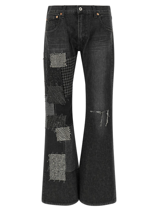Jeans by Junya Watanabe for women in denim cotton black, dark-gray, houndstooth, herringbone & patchwork presents a refined pantology silhouette, artfully defined by a refined pantology flared, long, and a sophisticated .