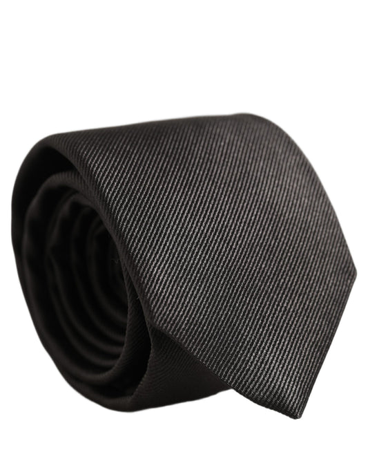 Necktie by Dolce & Gabbana for men in silk twill dark-gray features a distinguished silhouette, perfectly showcasing the distinguished details of Silk Twill Necktie.