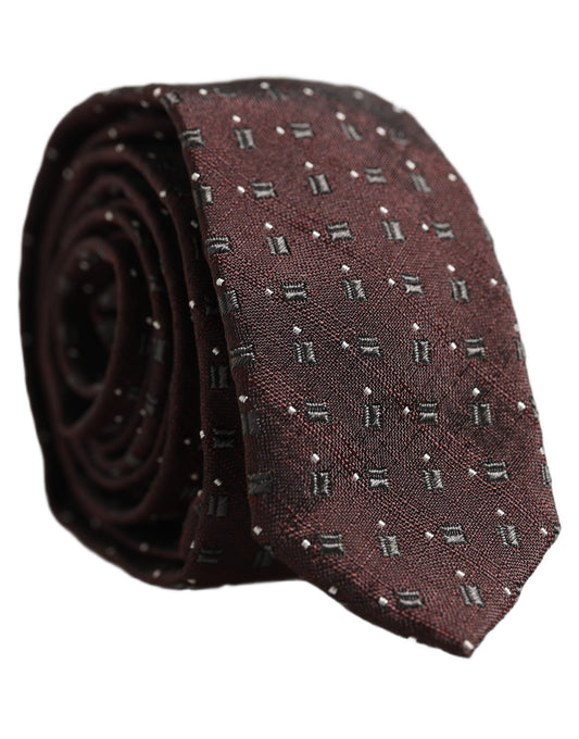 Necktie by Dolce & Gabbana for men in polyester & silk burgundy & patterned features a distinguished silhouette, artfully capturing the essence of the distinguished Polyester & Silk Necktie design for a sophisticated look.