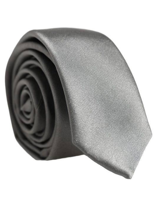 Necktie by Dolce & Gabbana for men in silk satin gray showcases a stately silhouette, expertly detailed with a stately finish that perfectly captures the sophisticated essence of the Silk Satin Necktie.