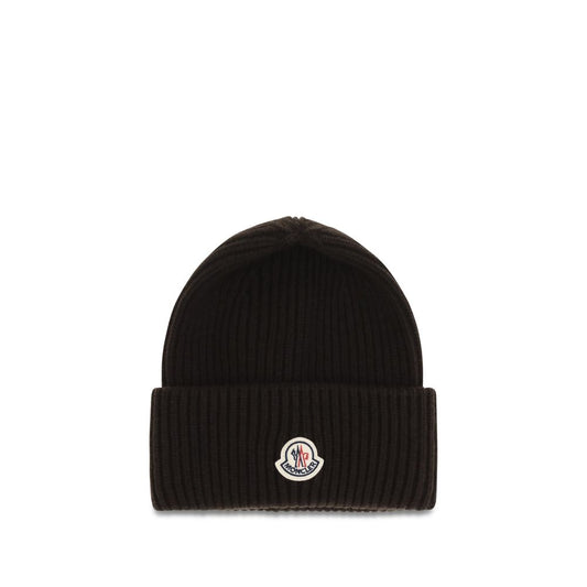 Beanie Hat by Moncler for men in cashmere wool brown features a distinguished knit construction, showcasing the sophisticated silhouette and distinguished finish of the Cashmere Wool Beanie Hat.
