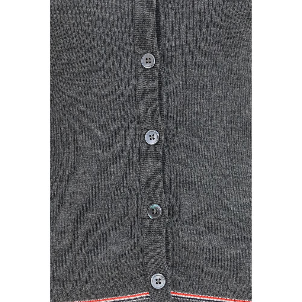 Cardigan by Thom Browne for women in merino wool gray, signature & striped features a dramatic silhouette, showcasing a sophisticated and dramatic detail for a timeless, premium look.
