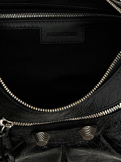 Shoulder Bag by Balenciaga for women in cotton canvas & lamb leather black & silver features an effortlessly chic silhouette with a secure zipper, ample , and versatile shoulder-strap, adjustable-strap & handle for effortlessly chic everyday luxury.