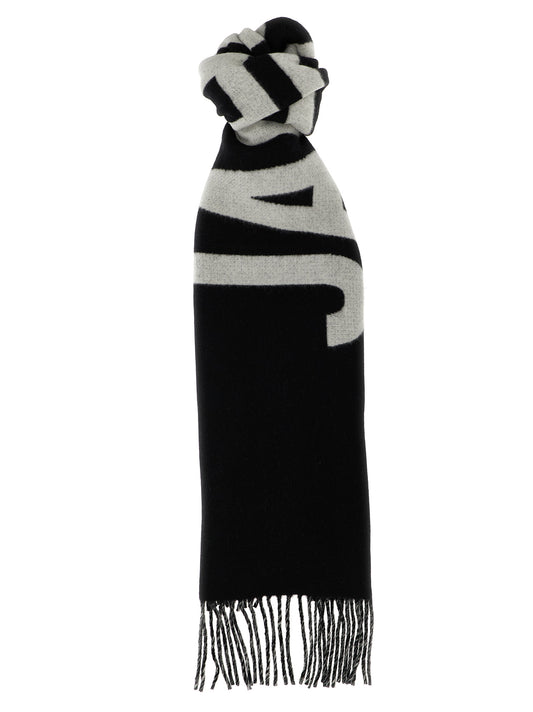 Scarf by Jacquemus for men in virgin wool black & signature features a snug silhouette, perfectly showcasing the elegant drape and premium finish of the Virgin Wool Foulard Fringes Scarf.