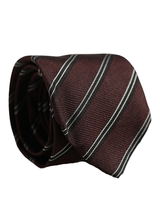 Necktie by Dolce & Gabbana for men in silk & viscose burgundy & striped features an stately silhouette that beautifully highlights the sophisticated style of the Silk & Viscose Necktie.