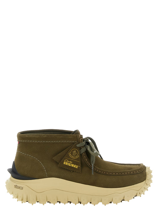 Ankle Boots by Moncler for men in tu suede & leather bicolour, green & olive features an effortless chic silhouette from the Men's TU Suede & Leather Ankle Boots collection, showcasing a effortless chic and refined for an effortless chic look.