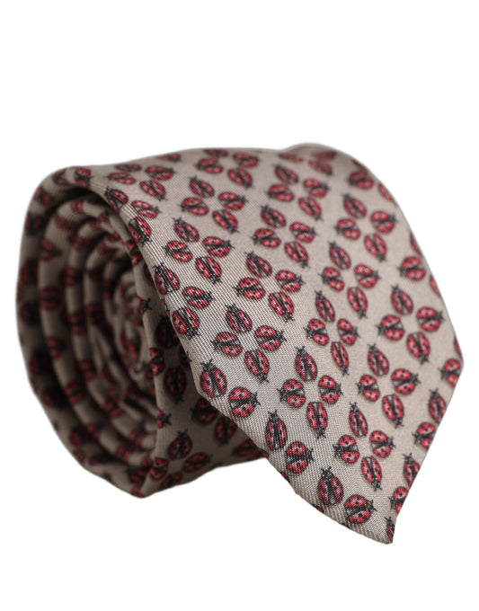 Necktie by Dolce & Gabbana for men in silk beige features a distinguished silhouette, artfully capturing the essence of the distinguished Silk Necktie design for a sophisticated look.