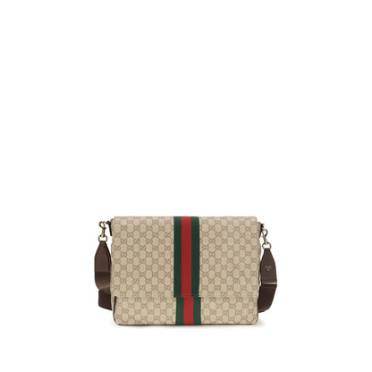 Medium 2-in-1 Shoulder & Crossbody Flap Bag by Gucci for men in leather & canvas beige & striped showcases a enviable silhouette, artfully detailed with a secure flap, organized , and versatile crossbody-strap, shoulder-strap & adjustable-strap for a enviable look.