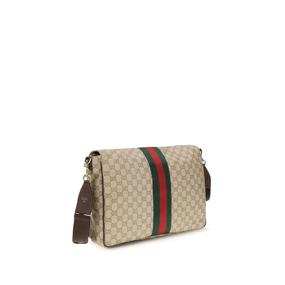 Medium 2-in-1 Shoulder & Crossbody Flap Bag by Gucci for men in leather & canvas beige & striped features a effortless chic silhouette with a secure flap, ample , and versatile crossbody-strap, shoulder-strap & adjustable-strap for a effortless chic finish.