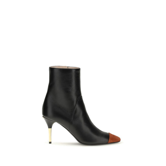Stiletto Ankle Boots by Valentino Garavani for women in bos taurus calf nappa & suede leather black & gold features an avant-garde Women's Bos Taurus Calf Nappa & Suede Leather Stiletto Ankle Boots silhouette, defined by a sophisticated stiletto and a avant-garde pointed toe style.