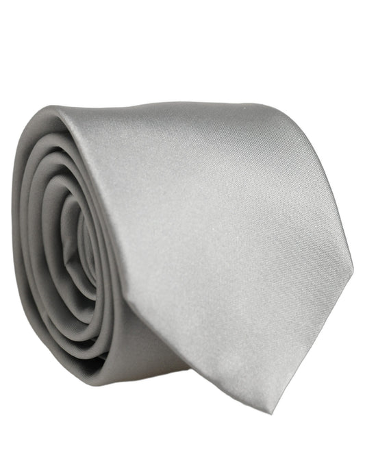 Necktie by Dolce & Gabbana for men in silk satin gray showcases a stately silhouette, expertly detailed with a stately finish that perfectly captures the sophisticated essence of the Silk Satin Necktie.
